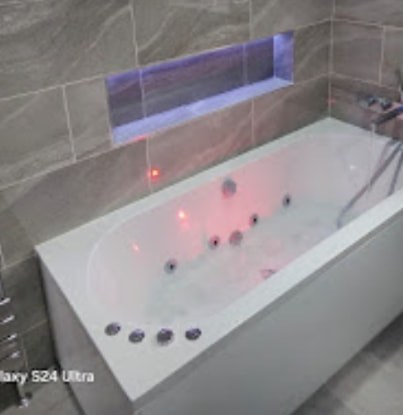 Bath installation in a tiled bathroom